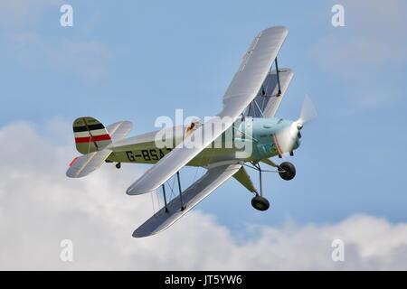 Bücher Jungmann G-BSAJ with the 1936 Berlin Olympics colour scheme Stock Photo