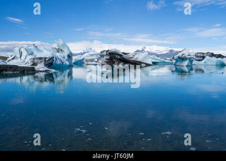 Iceland - Giant ice floes on joekulsarlon glacier lagoon with blue sky Stock Photo