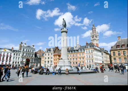 Lille (northern France): real estate in the heart of the city centre with passers-by and typical facades with Flemish architecture in the Grand Place  Stock Photo