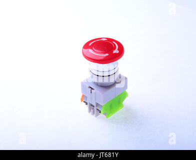 Close-up emergency stop button isolated on white background. Stock Photo