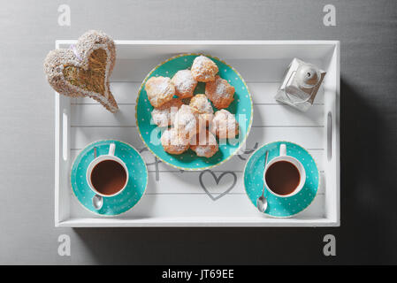 Breakfast on a tray with cookies and coffee Stock Photo