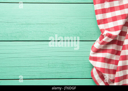 Tablecloth over colorful wooden table. Top view. Stock Photo