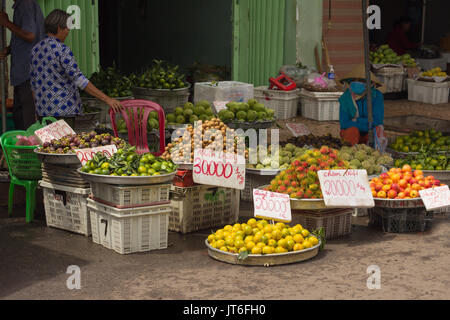 street market vendor selling fresh tropical fruit Stock Photo