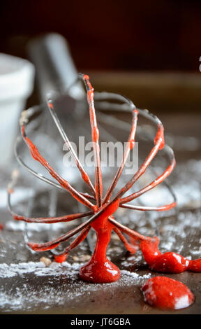 A whisk covered in Strawberry sauce Stock Photo