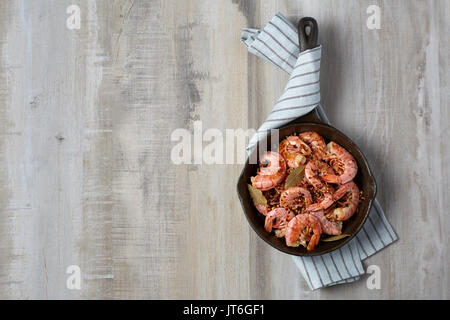 Cooked red shrimp on a light background. Prepared in a frying pan Stock Photo
