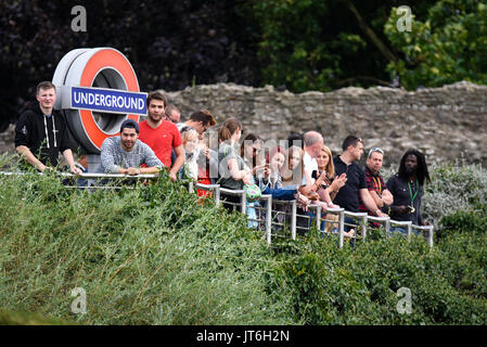 Spectators watching the World Championships Marathon racing from above the entrance to Tower Hill Underground station with bar and circle sign Stock Photo