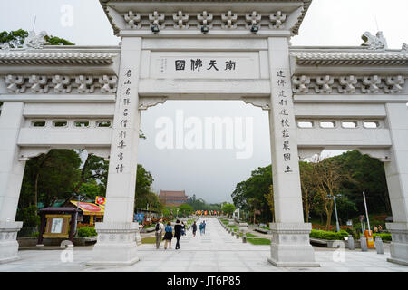 Big arch leading to Po Lin Monastery Stock Photo