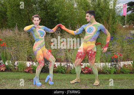 Female and Male Models painted by artist Carolyn Roper. The Perennial Garden. RHS Hampton Court Palace Flower Show. East Molesey, Surrey. UK 03.07.17 Stock Photo