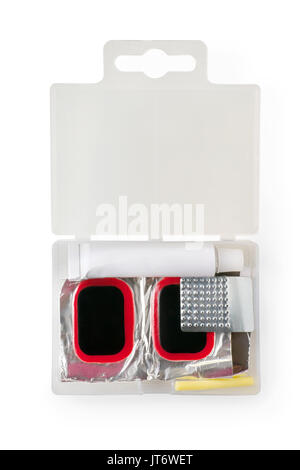 Bicycle tires repair kit in plastic box. Glue, patches and grater. Isolated on white, clipping path included Stock Photo