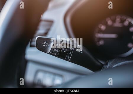 Close up on car lights switch. Car interior Stock Photo