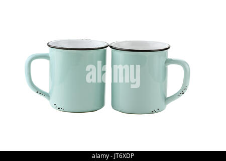 Two teal colored enamel coffee cups or mugs with copy space for logo isolated over a white background with clipping path included. Stock Photo