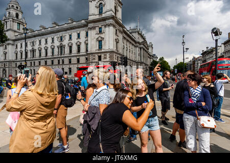 Tourists Taking Photographs, Westminster, London, UK Stock Photo