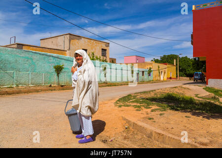 Bhalil, woman in white dress covering her head. Morocco, Maghreb North Africa Stock Photo