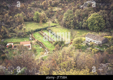 Mountain landscape with local village in mountains among trees in European country Stock Photo