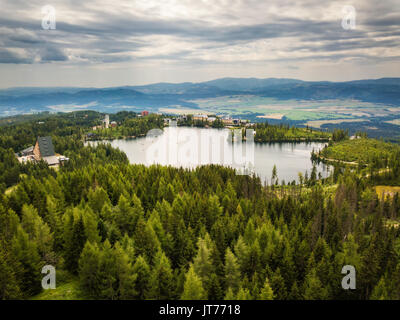 Glacial mountain lake Strbske Pleso in National Park High Tatras in Slovakia viewed from the olympic ski bridge Stock Photo