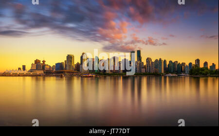 Sunset skyline of Vancouver downtown as seen from Stanley Park, British Columbia, Canada . Long exposure. Stock Photo