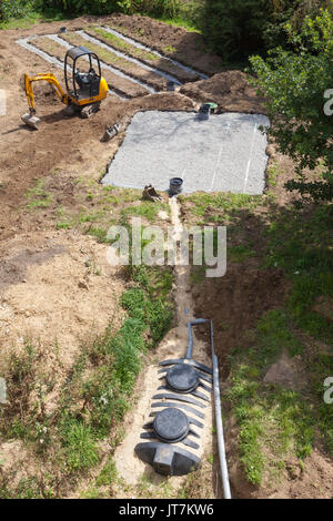 Complete new domestic septic tank sewerage installation viewed from above showing the  4000 litre tank, primary and secondary  gravel filter bed Stock Photo