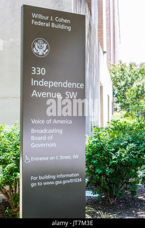 Washington DC, USA - July 3, 2017: Sign for Voice of America and Broadcasting Board of Governers Wilbur J. Cohen building in downtown Stock Photo