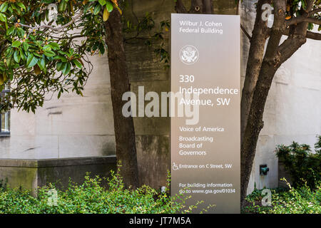 Washington DC, USA - July 3, 2017: Sign for Voice of America and Broadcasting Board of Governers Wilbur J. Cohen building in downtown Stock Photo