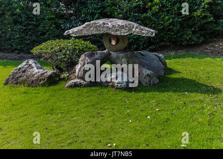 Sengan-en Garden is a  daimyo strolling garden in Kagoshima. It's most striking feature is its use of the volcano at Sakurajima beyond Kagoshima Bay a Stock Photo