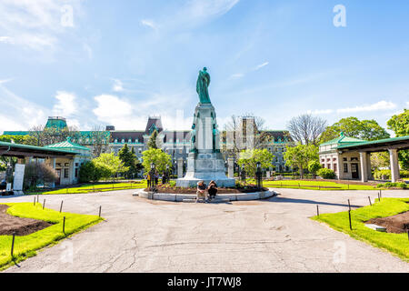 Montreal, Canada - May 28, 2017: St Joseph's Oratory on Mont Royal with people sitting by statue in Quebec region city Stock Photo