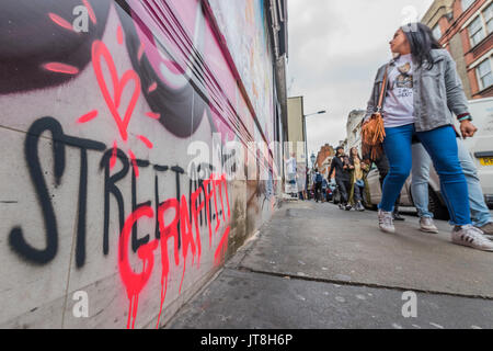 London, UK. 08th Aug, 2017. Graffiti on the outside of the Wardour St gallery - PichiAvo: In Gods We Trust – a new commission and exhibition at Unit London, Wardour Street, by Spanish artists PichiAvo. Both the exterior facade and interior walls of Unit London’s downstairs gallery are colour covered from head-to-foot by PichiAvo’s unique blend of graffiti and fine art styles. Credit: Guy Bell/Alamy Live News Stock Photo