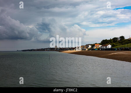 Herne Bay, Kent, UK, 8th August 2017. UK Weather News. A drizzily summers day at Hampton Herne Bay, ends with dark clouds and thunderstorms appearing over the Thames Estuary. View towards Herne Bay. Some sun breaks through the dark clouds. Credit: Richard Donovan/Live Alamy News Stock Photo