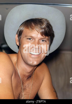 GLEN CAMPBELL (April 22, 1936 - August 8, 2017) was an American rock and country music singer, musician, songwriter, television host and actor. He is best known for a series of hits in the 1960s and 1970s, and for hosting a music and comedy variety show called The Glen Campbell Goodtime Hour on CBS television from January 1969 through June 1972. During his 50 years in show business, Campbell released more than 70 albums, and sold 45 million records accumulating 12 RIAA Gold albums, four Platinum albums and one Double-platinum album. Campbell died of Alzheimer's disease in Nashville, Tennessee, Stock Photo