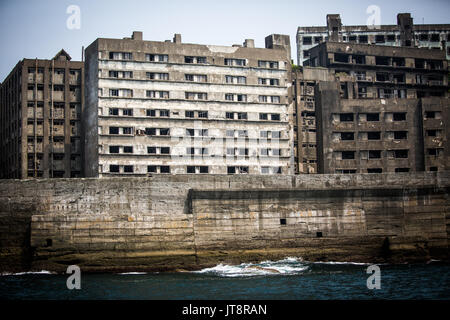 NAGASAKI, JAPAN - AUGUST 8: Hashima Island, commonly known as Gunkanjima or 'Battleship Island' in Nagasaki Prefecture, southern Japan on August 8, 2017. The island was a coal mining facility until its closure in 1974 is a symbol of the rapid industrialization of Japan, a reminder of its dark history as a site of forced labor during the Second World War. The island now is recognized as UNESCO World Heritage sites of Japan Meiji Industrial Revolution. (Photo: Richard Atrero de Guzman/AFLO) Stock Photo