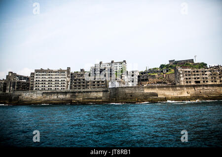 NAGASAKI, JAPAN - AUGUST 8: Hashima Island, commonly known as Gunkanjima or 'Battleship Island' in Nagasaki Prefecture, southern Japan on August 8, 2017. The island was a coal mining facility until its closure in 1974 is a symbol of the rapid industrialization of Japan, a reminder of its dark history as a site of forced labor during the Second World War. The island now is recognized as UNESCO World Heritage sites of Japan Meiji Industrial Revolution. (Photo: Richard Atrero de Guzman/AFLO) Stock Photo