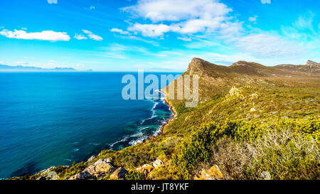 The rugged coast of the Atlantic Ocean and wind swept peaks on the Cape Peninsula with Cape Agulhus, the most southerly point of the African continent Stock Photo