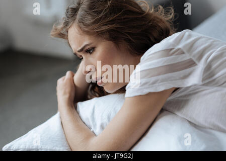 Cheerless sad woman feeling unhappy Stock Photo