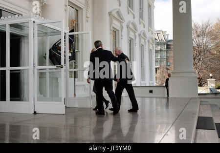 Washington, D.C. - March 5, 2008 -- United States President George W. Bush welcomes the Republican presidential nominee Sen. John McCain (R-AZ) (R) and his wife Cindy McCain (0bscured) to the White House March 5, 2008 in Washington, DC. Bush will announce his endorsement of McCain for the GOP nomination in the Rose Garden after a private lunch. McCain reached the required 1,191 delegates necessary to clinch the nomination after Tuesday primaries in Ohio, Texas, Vermont and Rhode Island put him over the top.  .Credit: Chip Somodevilla - Pool via CNP /MediaPunch Stock Photo