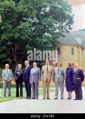 'Class photo' of the G-7 leaders from the Economic Summit in front of the Colonial Capitol in Williamsburg, Virginia on May 29, 1983.  From left to right:  Prime Minister Pierre Trudeau of Canada, President Gaston Thorn of the European Commission, Chancellor Helmut Kohl of West Germany, President Francois Mitterrand of France, President Reagan, Prime Minister Yasuhiro Nakasone of Japan, Prime Minister Margaret Thatcher of the United Kingdom, and Prime Minister Amintore Fanfani of Italy. Credit: Arnie Sachs / CNP /MediaPunch Stock Photo