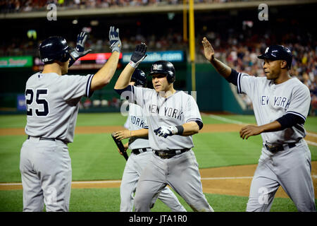 New York Yankees first baseman Mark Teixeira (25), left, congratulates teammates Russell Martin (55), center, and Dewayne Wise (45) after they scored on a Derek Jeter single and a throwing error by Washington Nationals shortstop Ian Desmond in the seventh inning at Nationals Park in Washington, D.C. on Friday, June 15, 2012.  The Yankees won the game 7 - 2..Credit: Ron Sachs / CNP./MediaPunch (RESTRICTION: NO New York or New Jersey Newspapers or newspapers within a 75 mile radius of New York City) Stock Photo