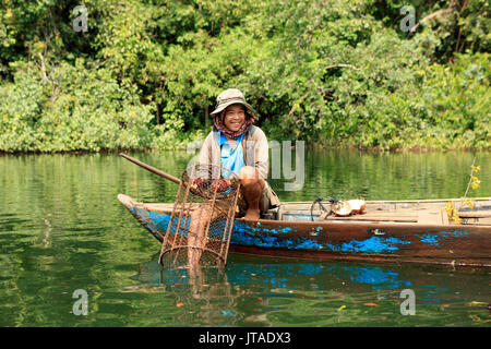 Crayfish fisherman on a tributary of the Phipot River in the Cardamom mountains, Koh Kong, Cambodia, Indochina, Southeast Asia Stock Photo