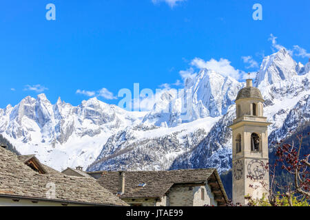 Blue sky in spring on bell tower and stone roofs, Soglio, Maloja, Bregaglia Valley, Engadine, canton of Graubunden, Switzerland Stock Photo