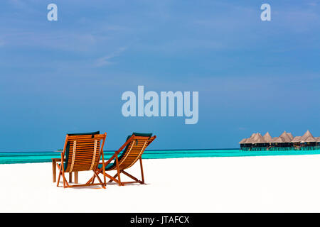 Wooden sun loungers on beach, Coco Palm, Dhuni Kolhu, Baa Atoll, Republic of Maldives, Indian Ocean, Asia Stock Photo