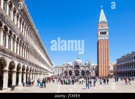 Campanile tower, Piazza San Marco (St. Marks Square) with tourists and Basilica di San Marco, Venice, UNESCO, Veneto, Italy