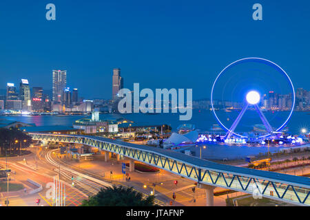View of Star Ferry pier, observation wheel and Tsim Sha Tsui skyline, Central, Hong Kong, China, Asia Stock Photo