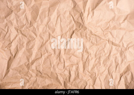 Close-up top view of old brown crumpled paper texture Stock Photo