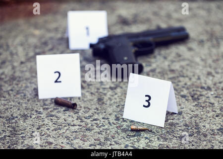 crime scene with evidences and markers on the asphalt Stock Photo