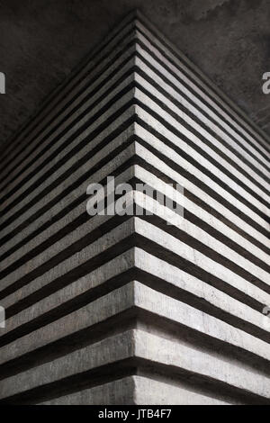 The effective angle of a concrete building in the form of three-dimensional stripes. Stock Photo