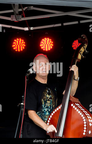 Double bass player in a rock and roll band, UK Stock Photo