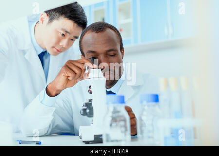 young doctors in uniform working at testing laboratory, laboratory technicians Stock Photo