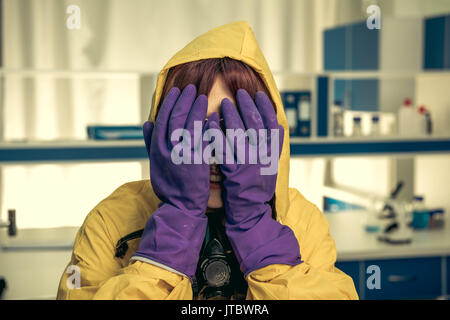 young girl laboratory technician in personal protective equipment, chemical lab Stock Photo