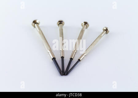 screwdriver mini tool on a white background chromed steel with crosshead tip Stock Photo