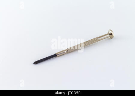 screwdriver mini tool on a white background chromed steel with crosshead tip Stock Photo
