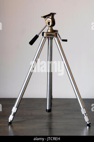 Vintage metal tripod for analog photography Stock Photo