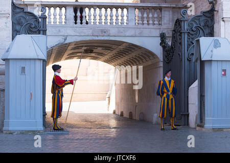 VATICAN CITY, VATICAN - OCTOBER 16, 2016: Famous Swiss Guard guarding the entrance to the Vatican City. The Papal Guard with about 100 men is the worl Stock Photo